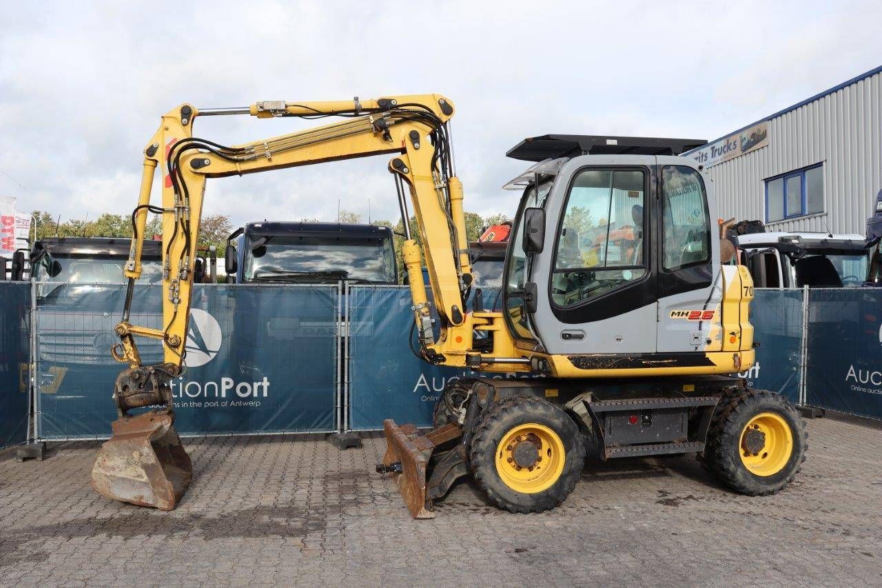 Wheeled excavator New Holland MH 2.6 Diesel 2011