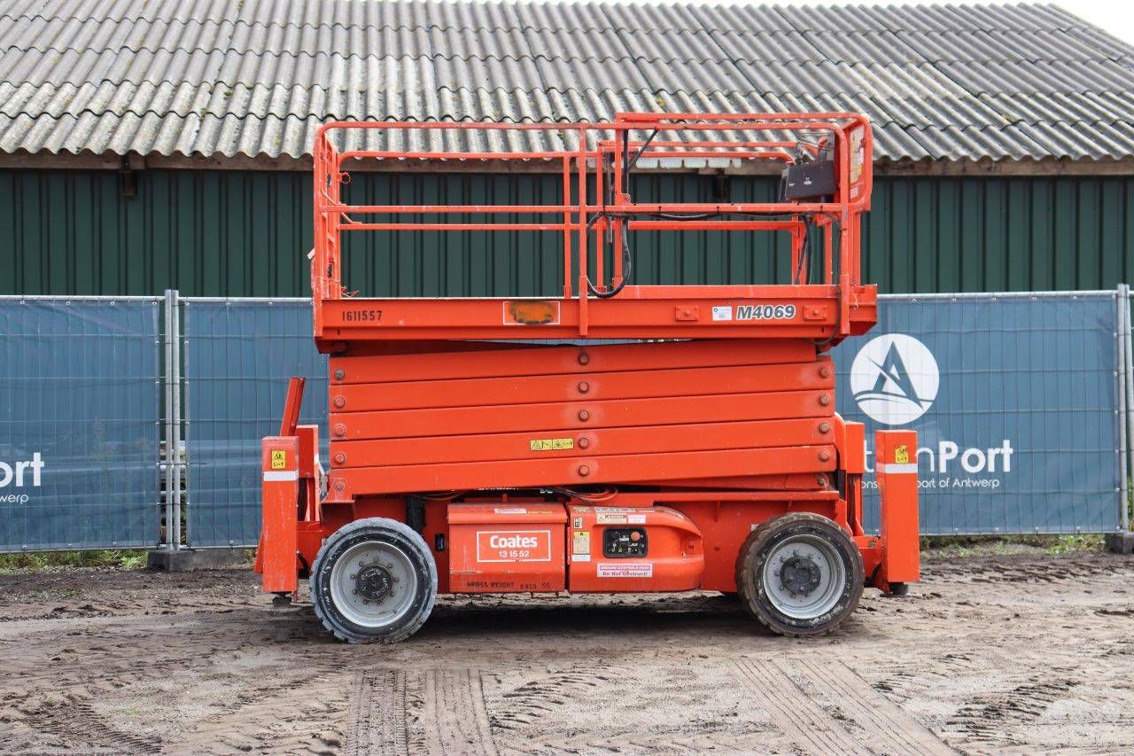 Piattaforma elevatrice a forbice JLG M4069 elettrica, portata 200 kg, altezza 14,2 m, anno di produzione 2007.