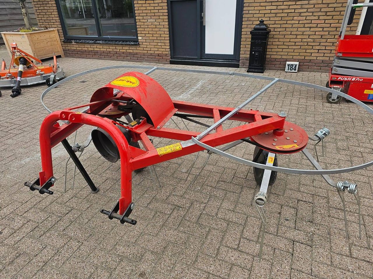 Mini tractor tedder